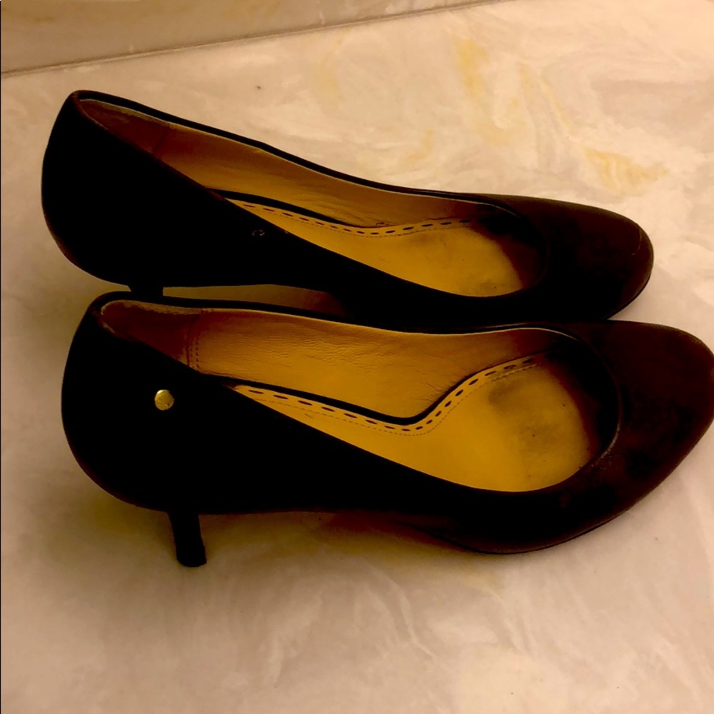 Brown leather coach pumps